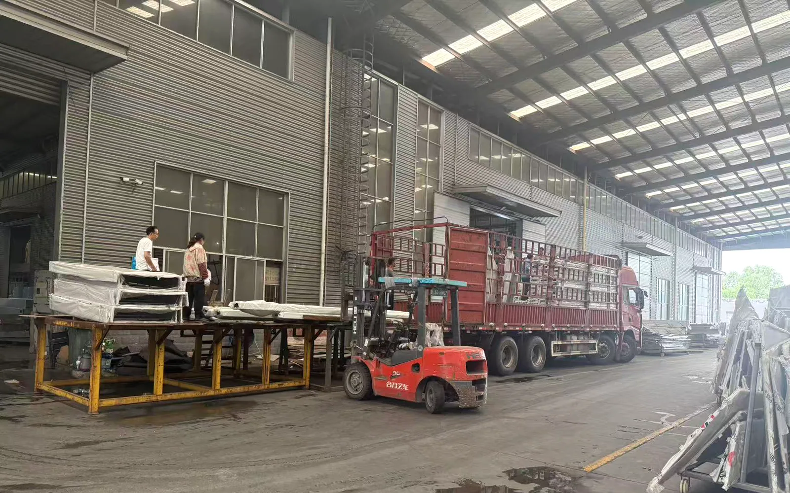 Real loading operation with forklift and truck